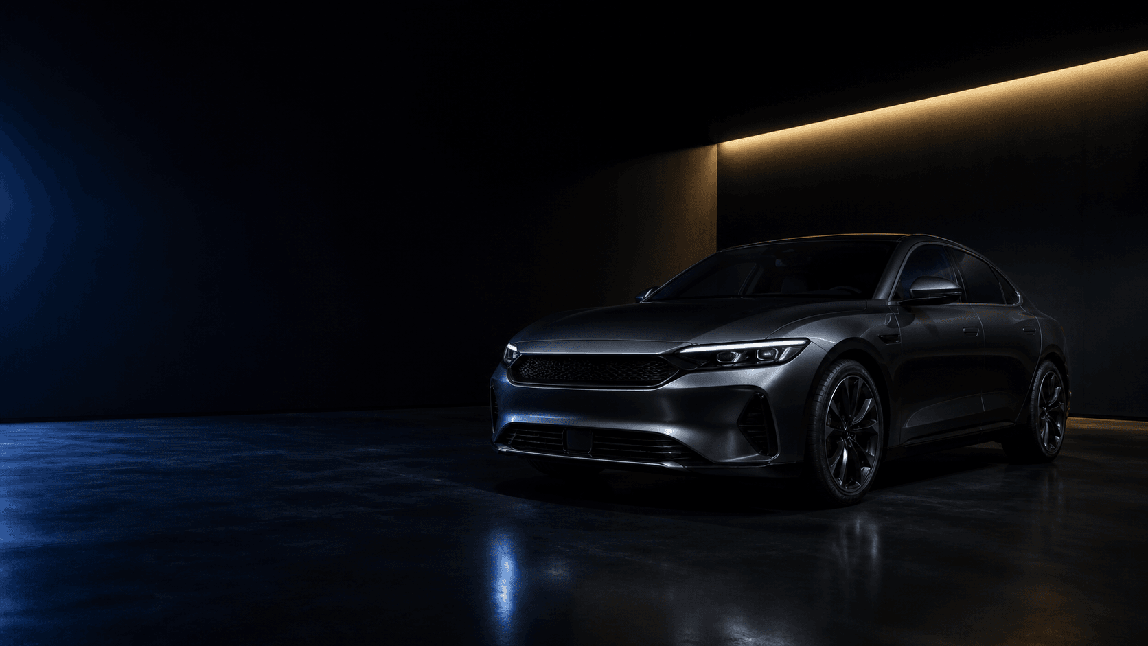 Automóvel grafite sob iluminação azul e dourada
